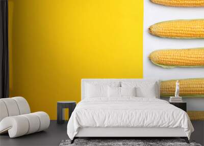 Flat lay composition with tasty sweet corn cobs on color background Wall mural