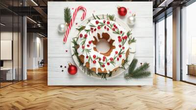 Flat lay composition with traditional Christmas cake decorations on white wooden table Wall mural