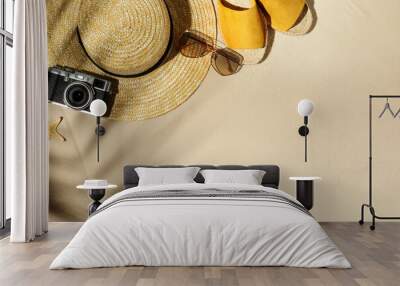 Flat lay composition with vintage camera and beach objects on sand. Space for text Wall mural