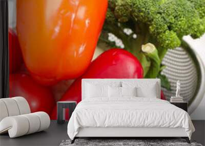 Fresh clean vegetables in colander on countertop near sink, closeup Wall mural