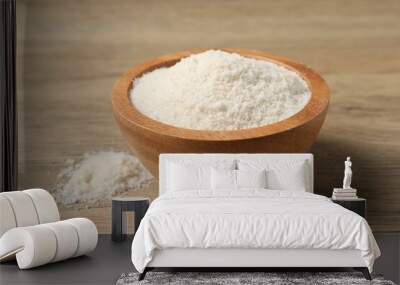 Fresh coconut flour in bowl on wooden table, closeup Wall mural