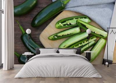 Fresh green jalapeno peppers on wooden table, flat lay Wall mural