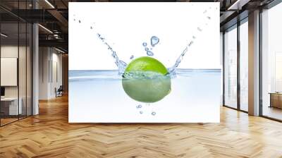 Fresh lime falling into water against white background Wall mural