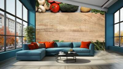 Fresh products and wooden board with space for text, flat lay. Healthy cooking Wall mural