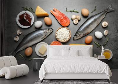 Fresh products rich in vitamin D on grey table, flat lay Wall mural