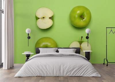 Fresh ripe apples on green background, flat lay Wall mural