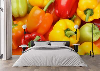 Fresh ripe colorful bell peppers as background, top view Wall mural