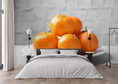 Fresh ripe juicy tangerines on grey table Wall mural