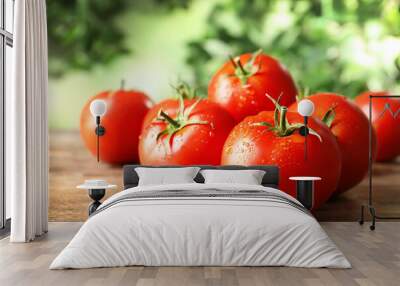 Fresh ripe tomatoes on wooden table, closeup Wall mural