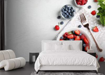 Fresh tasty fruit salad on white wooden table, flat lay. Space for text Wall mural