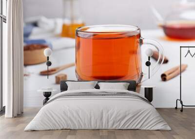 Freshly brewed rooibos tea on white wooden table Wall mural