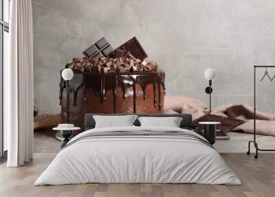 Freshly made delicious chocolate cake on marble table against grey background. Space for text Wall mural