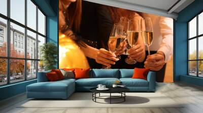 Friends with glasses of sparkling wine celebrating New Year, closeup Wall mural