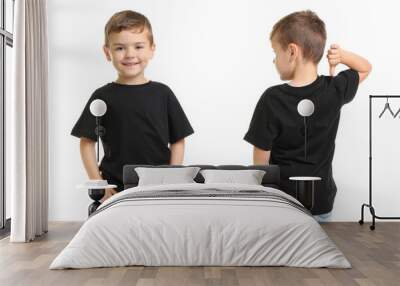 Front and back views of little boy in black t-shirt on white background. Mockup for design Wall mural