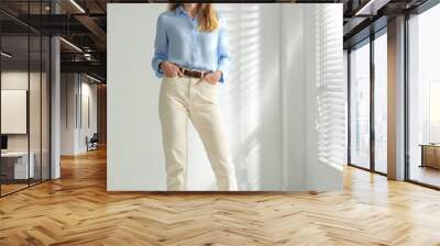 Full length portrait of beautiful young businesswoman in office Wall mural