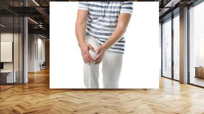 Full length portrait of senior man having knee problems on white background Wall mural