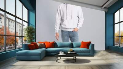 Full length portrait of young man in sweater on grey background. Mock up for design Wall mural