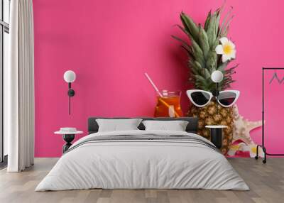 Funny pineapple with cocktail, plumeria flowers and starfish on pink background, space for text. Creative concept Wall mural