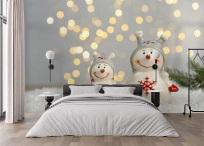 Funny snowman figure on artificial snow against blurred lights Wall mural