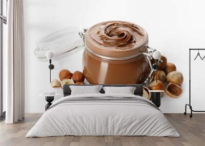 Glass jar with tasty chocolate hazelnut spread and nuts on white background Wall mural