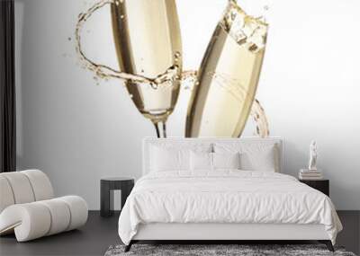 Glasses with sparkling wine and splashes on white background Wall mural