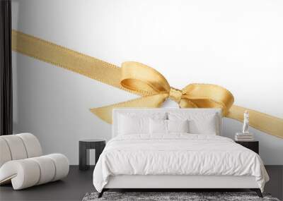 Golden satin ribbon with bow on white background, top view Wall mural