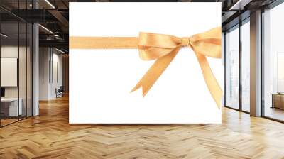 Golden satin ribbon with bow on white background, top view Wall mural