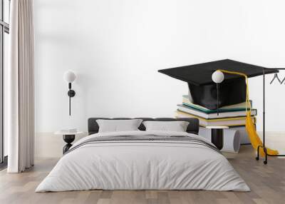 Graduation hat with books and diploma on table against white background Wall mural