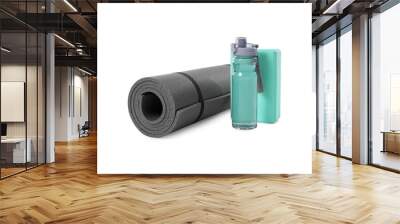 Grey exercise mat, yoga block and bottle of water isolated on white Wall mural