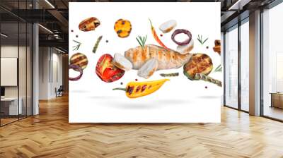 Grilled vegetables and chicken falling on white background Wall mural