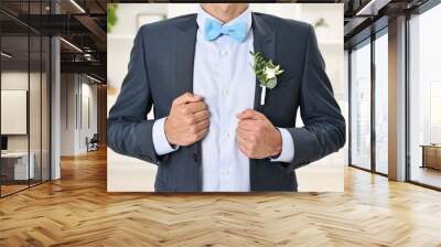 Groom in suit with stylish boutonniere indoors, closeup Wall mural