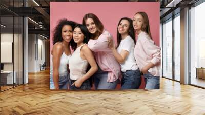 Group of women with different body types on pink background Wall mural