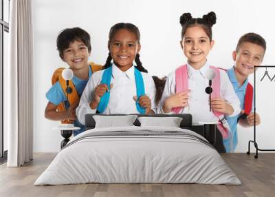 Happy children in school uniform on white background Wall mural