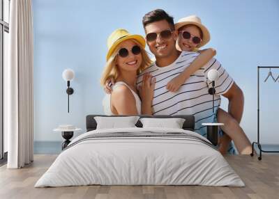 Happy family at beach on sunny summer day Wall mural