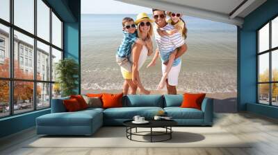 Happy family at beach on sunny summer day Wall mural