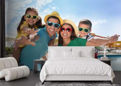 Happy family at water park. Summer vacation Wall mural