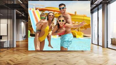 Happy family at water park. Summer vacation Wall mural