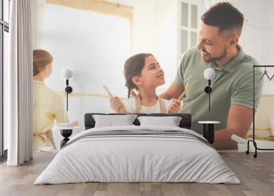 Happy family cooking salad together in kitchen Wall mural