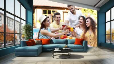 Happy friends with drinks having fun at barbecue party outdoors Wall mural