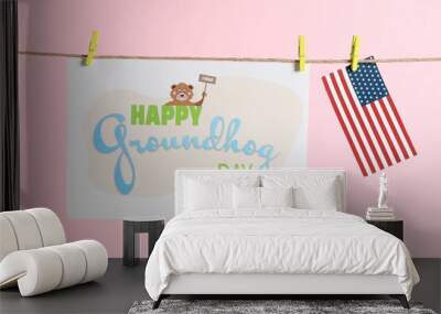 Happy Groundhog Day greeting card and American flag hanging on pink background Wall mural