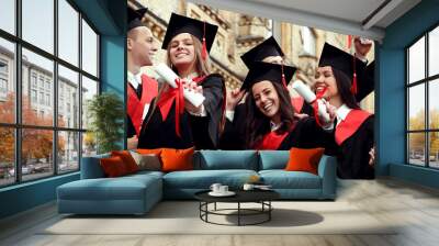 Happy students with diplomas near campus. Banner design Wall mural