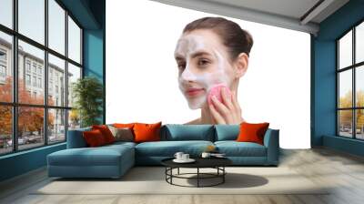 Happy young woman washing her face with sponge on white background Wall mural