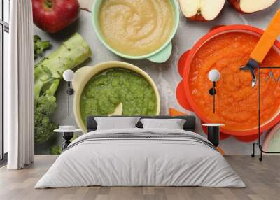 Healthy baby food. Different tasty puree in bowls on light grey marble table, flat lay Wall mural