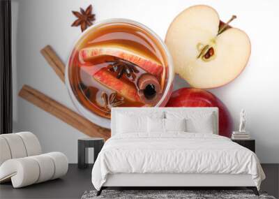 Hot mulled cider and ingredients on white background, top view Wall mural