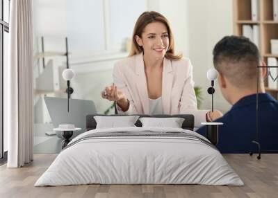 Human resources manager conducting job interview with applicant in office Wall mural