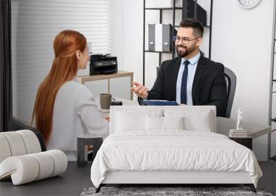 Immigration. Woman having interview with embassy worker in office Wall mural