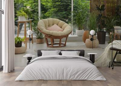 Indoor terrace interior with soft papasan chair and green plants Wall mural