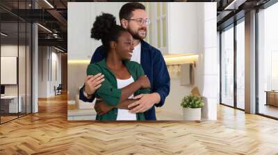 International relationships. Portrait of lovely couple in kitchen Wall mural