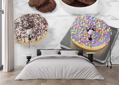 Kitchen scale with donut on white marble table, closeup Wall mural