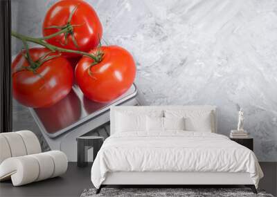 Kitchen scale with tomatoes on grey textured table. Space for text Wall mural